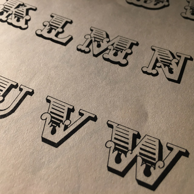 Photo of type specimen page from a lettering book